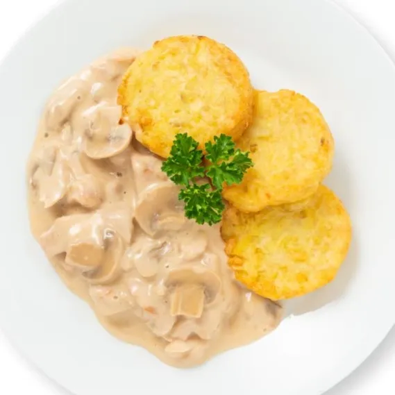 Emincé de poulet à la zurichoise avec rösti